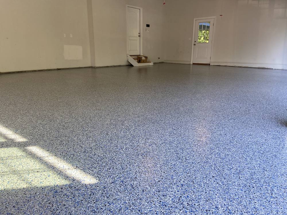 Garage floor after coating, blue and white flake finish